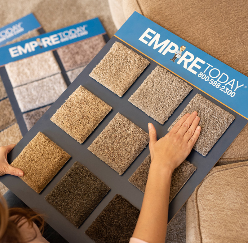 family sitting on Empire Today carpet